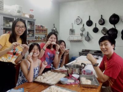 Daniel's class wrapping dumplings for Chinese New Year